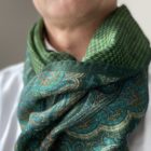 green scarf with orange motif