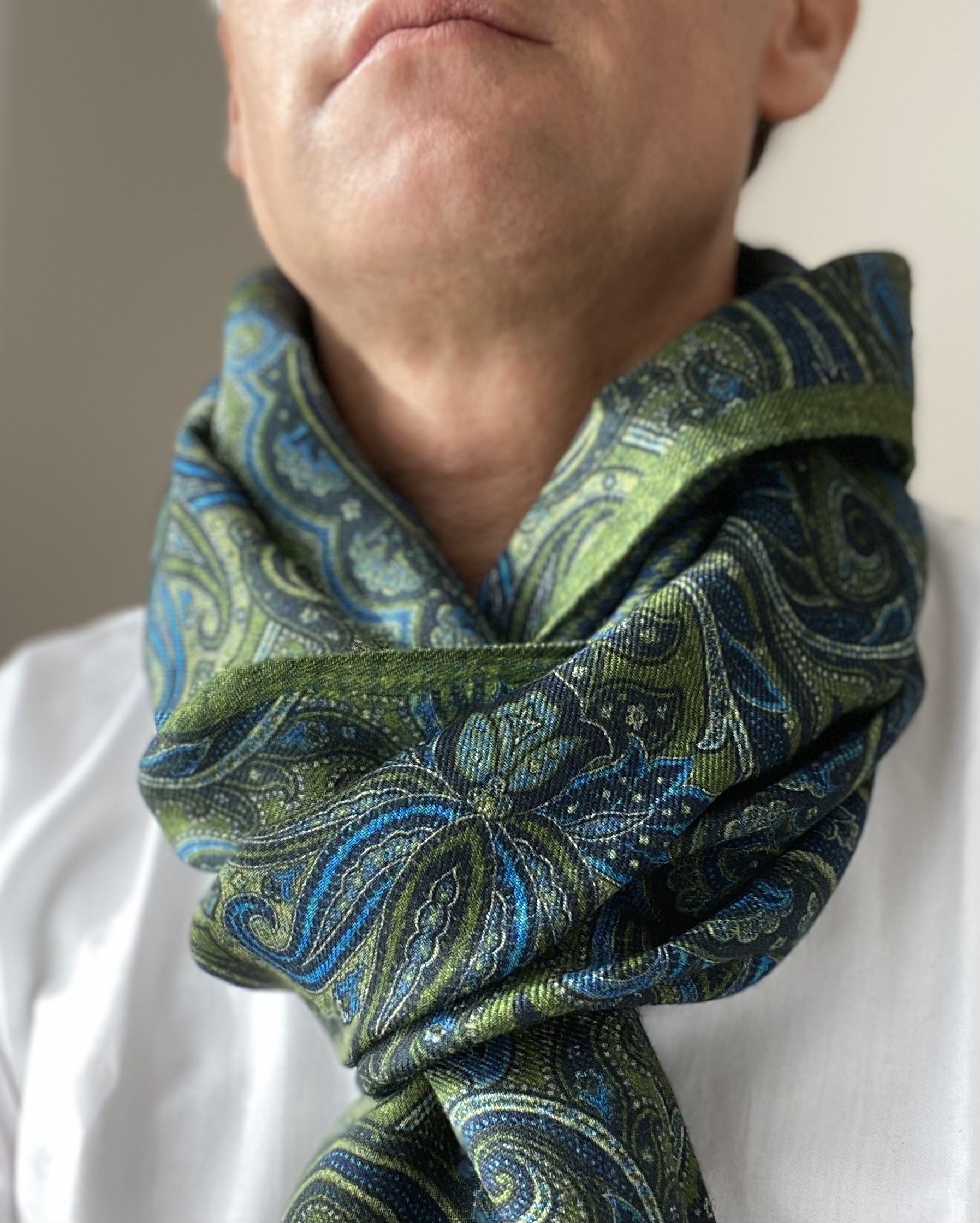 green scarf with blue motif